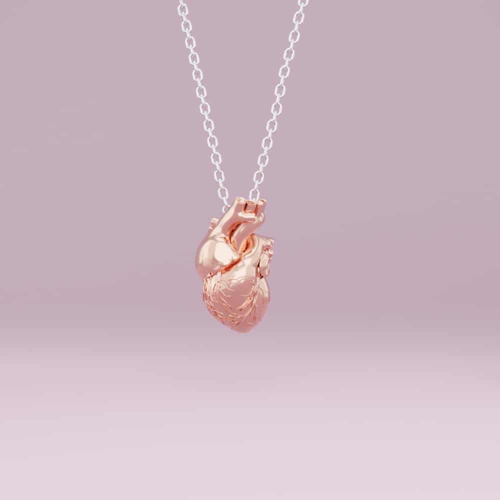 Anatomical heart necklace in rose gold.